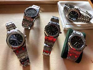 Several used Audemars Piguet watches on a table